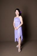 portrait of a woman in purple dress
