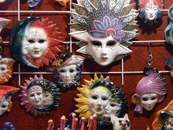 variety of carnival masks on stand