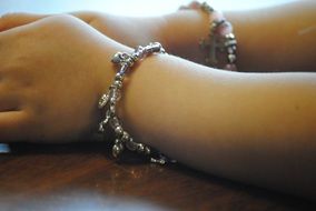 hands in fashionable bracelets