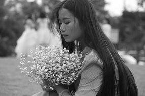 portrait of beautiful long haired Woman with flowers