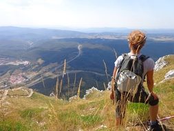 girl on top of the mountain looking into the distance