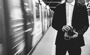 man with camera in subway