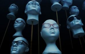 the heads of the mannequins in the glasses