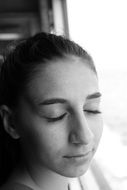 black and white portrait of a girl with closed eyes