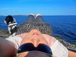 woman and dog at the sea