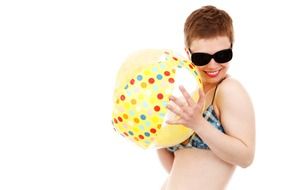 woman in a bikini with a beach ball