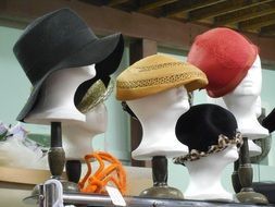 colorful hats on mannequins