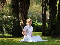 meditating woman in white dress