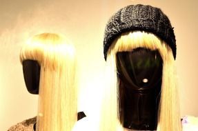 mannequin in blonde wig and black hat