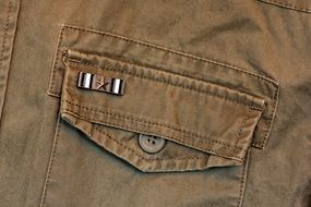 pocket on brown clothes close up