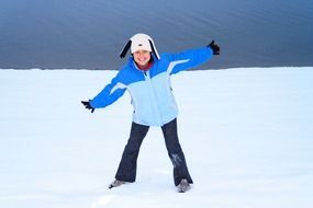 cheerful girl standing in the snow