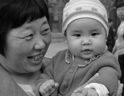 portrait of happy grandmother with baby