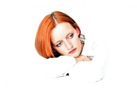 portrait of a woman with red hair on a white background