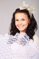 photo of a girl in lace with a bow on her head