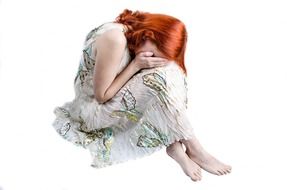 sad woman with red hair