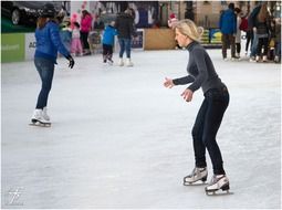 People on skating rink in open air