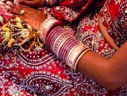 bridal bracelets on the hand of an indian bride