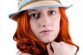 woman with red hair in hat