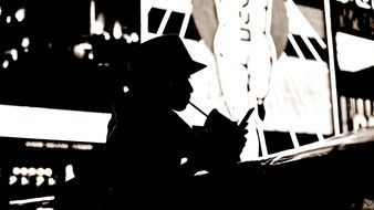 silhouette of a woman with a drink