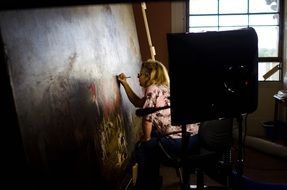 woman is painting