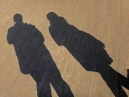 shadow of two people on the ground