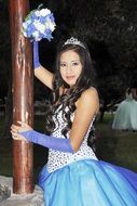 Happy young woman dressed up in a beautiful dress