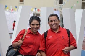 photo of asian team in red t-shirts