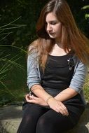 Sad long haired woman Nature view