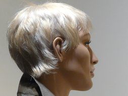 Mannequin's face with short fair hair