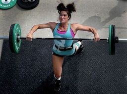 Girl power lifter training at the gym