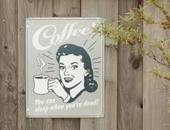 picture of a woman with a cup of coffee hanging on the wall