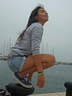 teen girl on a sea bank