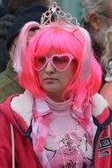 girl in a pink wig at the carnival