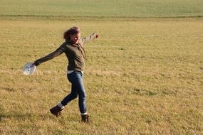 happy girl playing frisbee