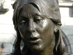 bronze sculpture of a woman close up
