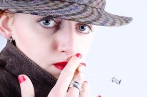 smoking woman in hat