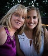 photo of two smiling girlfriends
