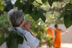 Praying woman in Thailand