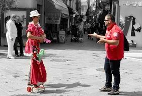 street photography of talking humans on a street