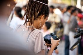 girl is looking at digital camera