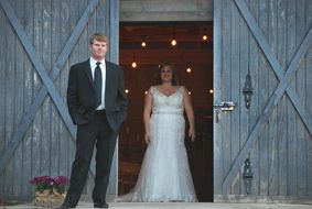 bride and groom coming out of wedding hall