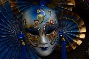 photo of blue carnival mask in venice