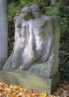 statue of a loving couple on a tombstone