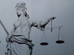 black and white image of justice sculpture