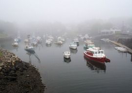 panorama of boats in the bay on a foggy day