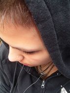 portrait of a young woman in a black hood