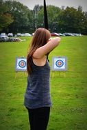 archery woman goal Green field view