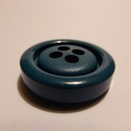 blue plastic button close up