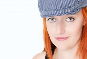 red-haired woman in cap