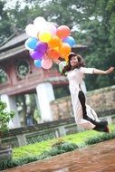 Asian girl with balloons